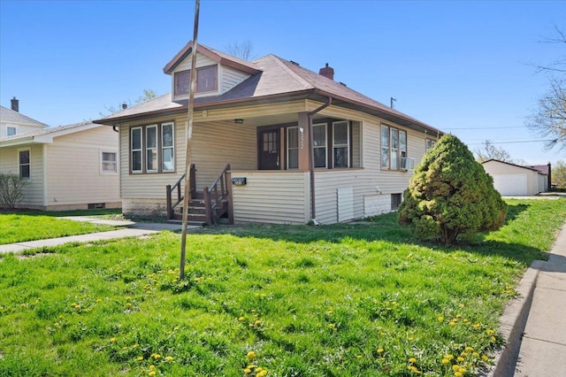 bungalow with a porch and a front lawn