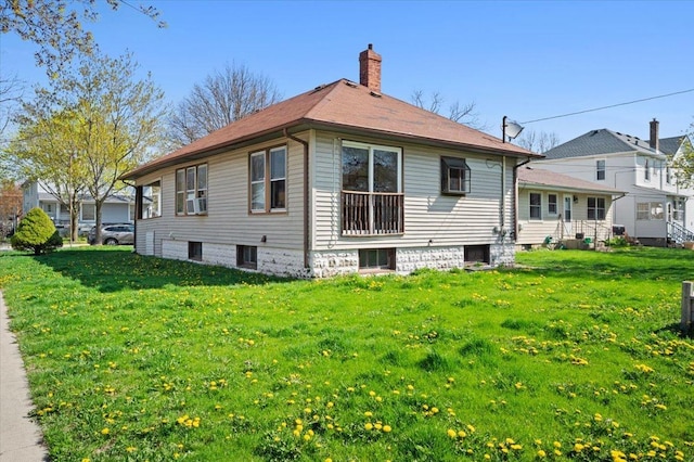 exterior space with a lawn and a chimney