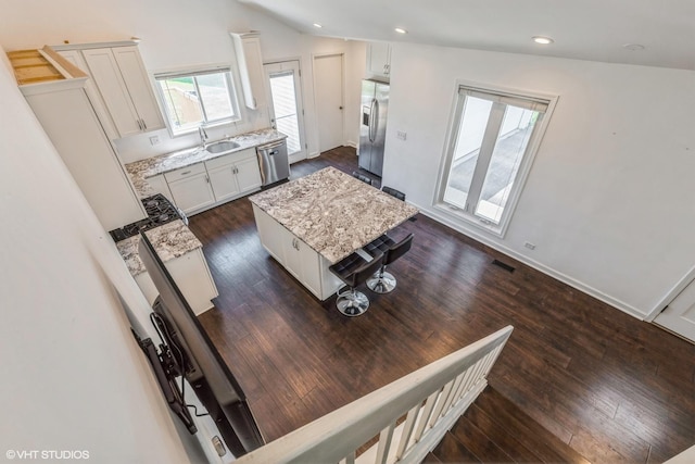 5116 Beechwood Ave, Gurnee, IL 60031 - living area with vaulted ceiling, dark wood finished floors, recessed lighting, and baseboards