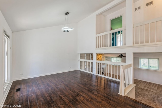 5116 Beechwood Ave, Gurnee, IL 60031 - unfurnished room featuring wood finished floors, a high ceiling, baseboards, and a ceiling fan