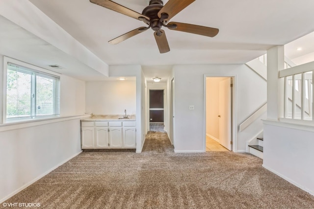 5116 Beechwood Ave, Gurnee, IL 60031 - carpeted spare room with a ceiling fan, baseboards, a sink, and stairway