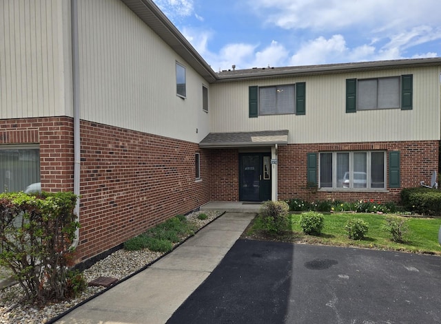 view of front of home with brick siding