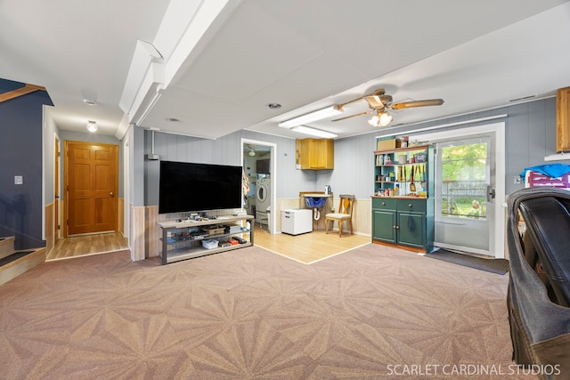212 S River Rd, Naperville, IL 60540 - living area featuring washer / clothes dryer, ceiling fan, and light wood-style flooring