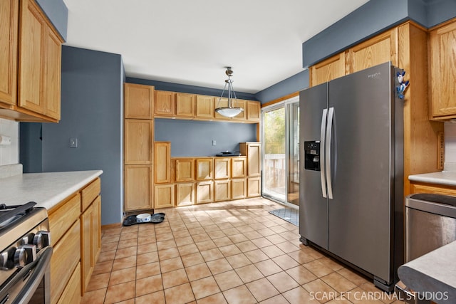 212 S River Rd, Naperville, IL 60540 - kitchen featuring appliances with stainless steel finishes, light countertops, light tile patterned floors, and hanging light fixtures