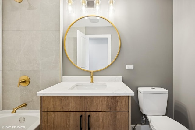 full bathroom featuring vanity, toilet, and a bathing tub