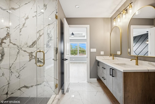 bathroom with a marble finish shower, marble finish floor, and a sink