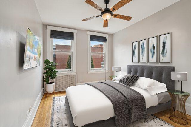 bedroom with baseboards, a ceiling fan, and wood finished floors