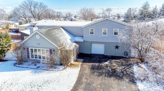 traditional-style home with driveway and a garage