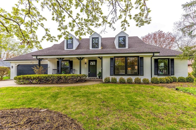 cape cod-style house featuring covered porch, driveway, roof with shingles, a front yard, and an attached garage