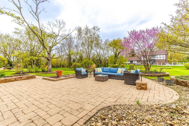 view of patio with fence and outdoor lounge area