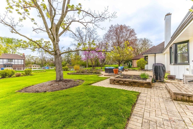 view of yard with a patio and an outdoor living space