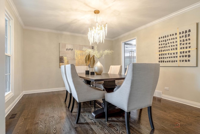 dining room with visible vents, dark wood finished floors, baseboards, and a chandelier