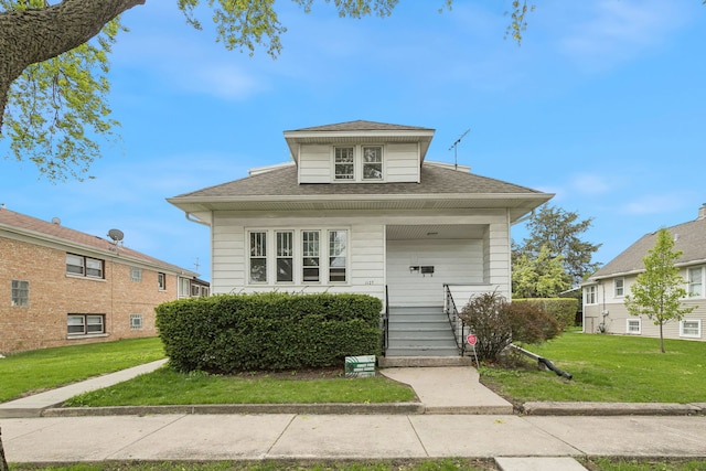 1127 Lathrop Ave, Forest Park, IL 60130 - bungalow-style home featuring roof with shingles and a front yard