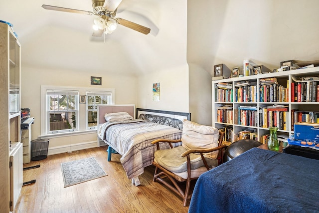 1127 Lathrop Ave, Forest Park, IL 60130 - bedroom featuring ceiling fan, wood finished floors, and lofted ceiling