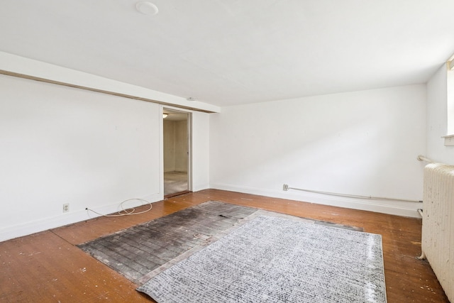 1127 Lathrop Ave, Forest Park, IL 60130 - empty room featuring baseboards, radiator heating unit, and wood finished floors