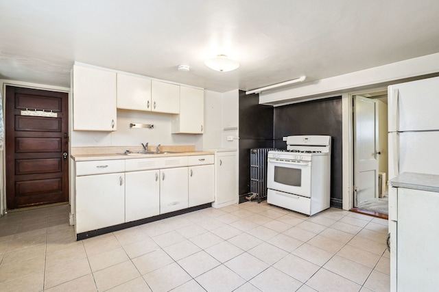 1127 Lathrop Ave, Forest Park, IL 60130 - kitchen featuring radiator, white appliances, light countertops, white cabinets, and a sink