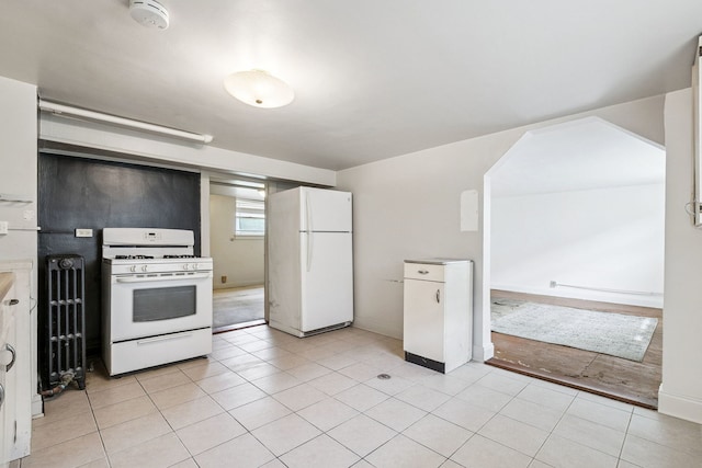 1127 Lathrop Ave, Forest Park, IL 60130 - kitchen featuring baseboards, light tile patterned floors, and white appliances