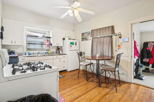 1127 Lathrop Ave, Forest Park, IL 60130 - kitchen featuring white appliances, white cabinetry, ceiling fan, and stainless steel countertops