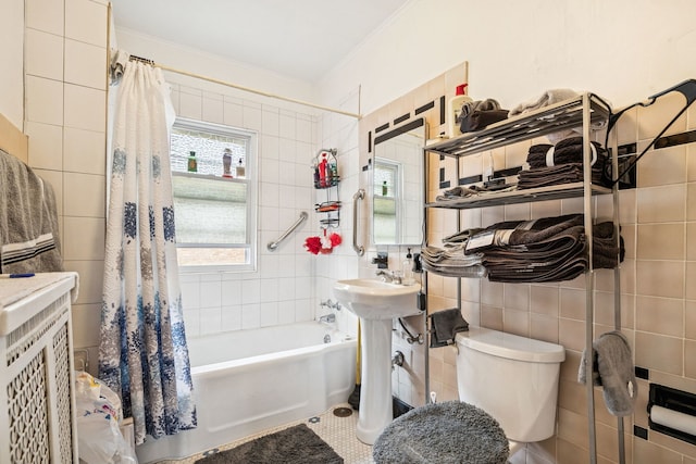 1127 Lathrop Ave, Forest Park, IL 60130 - full bathroom with crown molding, tile walls, a sink, toilet, and shower / bath combo with shower curtain
