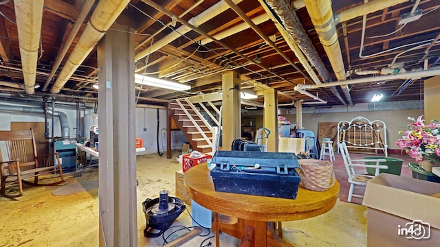 unfinished below grade area featuring stairs