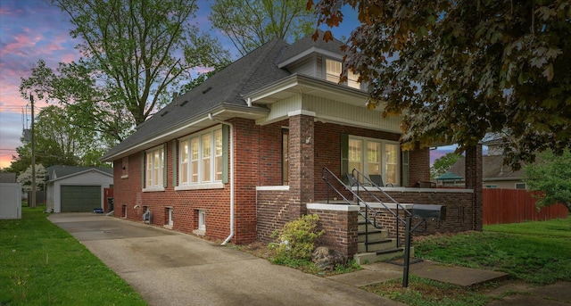 208 E Sale St, Tuscola, IL 61953 - view of front facade with brick siding, a garage, a porch, stairway, and an outdoor structure
