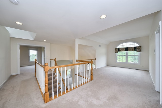 802 Ridgelawn Trl, Batavia, IL 60510 - hall with carpet floors, an upstairs landing, baseboards, recessed lighting, and vaulted ceiling
