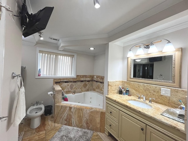 bathroom featuring crown molding, vanity, visible vents, and a jetted tub