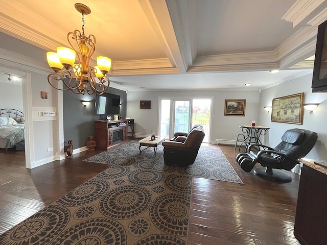 living room with dark wood-style flooring, crown molding, a baseboard heating unit, baseboards, and a notable chandelier