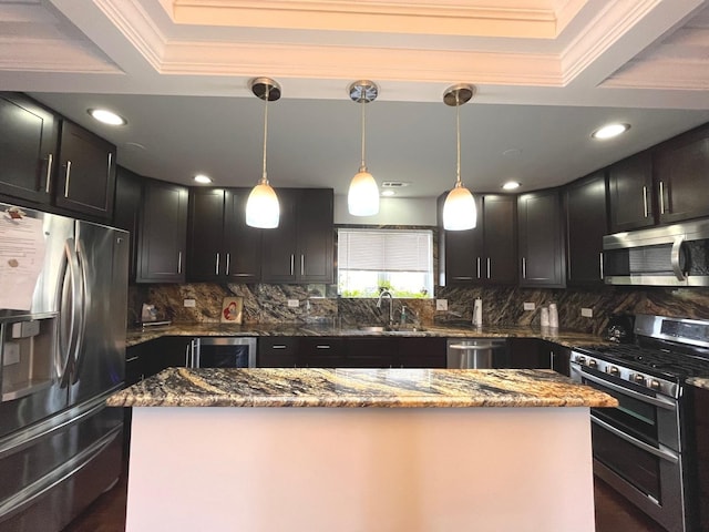 kitchen featuring decorative backsplash, appliances with stainless steel finishes, ornamental molding, and a sink