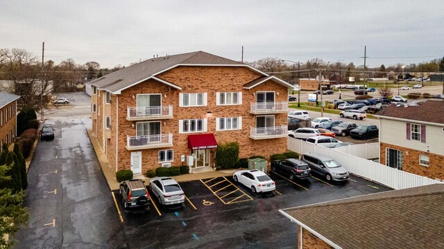 view of property with uncovered parking