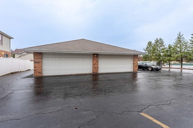 garage with fence