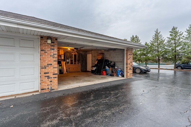 garage featuring aphalt driveway