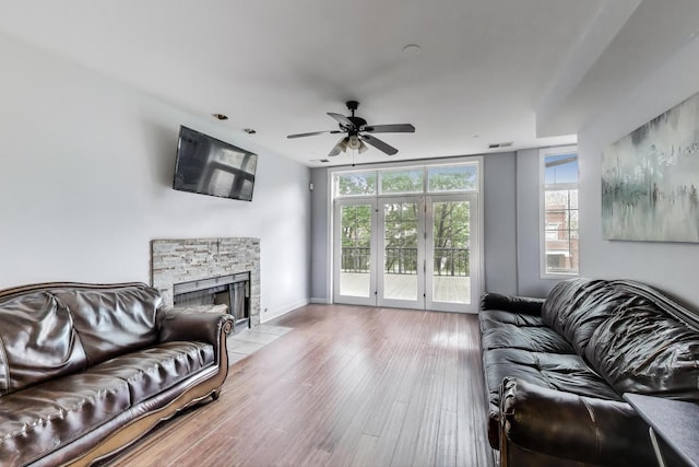 6527 S Drexel Ave, Chicago, IL 60637 - living area with a stone fireplace, a ceiling fan, wood finished floors, and baseboards