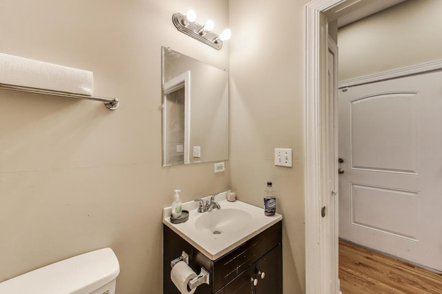 6527 S Drexel Ave, Chicago, IL 60637 - bathroom with vanity, toilet, and wood finished floors