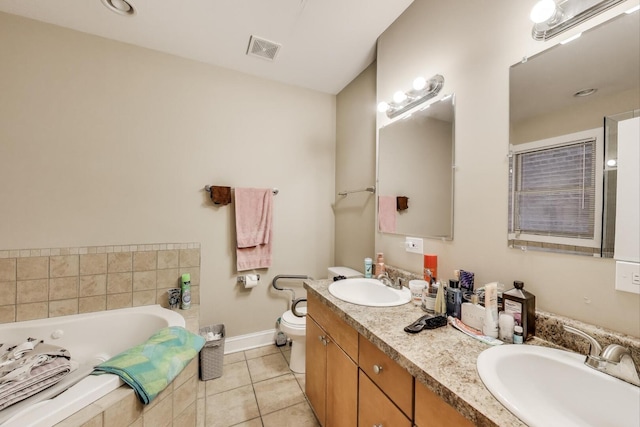 6527 S Drexel Ave, Chicago, IL 60637 - full bath with double vanity, a garden tub, tile patterned floors, baseboards, and toilet