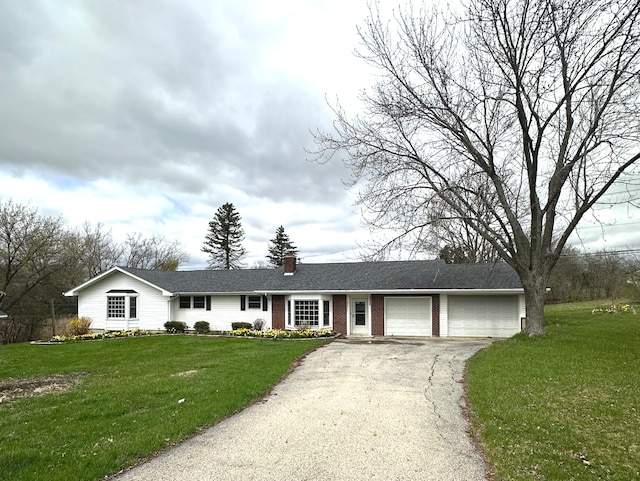 ranch-style home featuring an attached garage, a front lawn, driveway, and brick siding