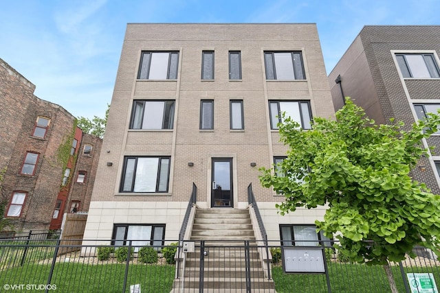 4816 S St Lawrence Ave Unit 302, Chicago, IL 60615 - view of front of home featuring entry steps and brick siding