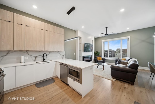 4816 S St Lawrence Ave Unit 302, Chicago, IL 60615 - kitchen featuring stainless steel appliances, a sink, modern cabinets, light countertops, and recessed lighting