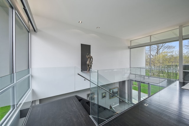 5N770 Pearson Dr, Wayne, IL 60184 - stairs featuring healthy amount of natural light, floor to ceiling windows, and wood finished floors