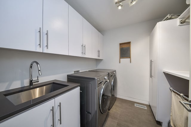 5N770 Pearson Dr, Wayne, IL 60184 - clothes washing area featuring cabinet space, washing machine and clothes dryer, dark tile patterned floors, and baseboards