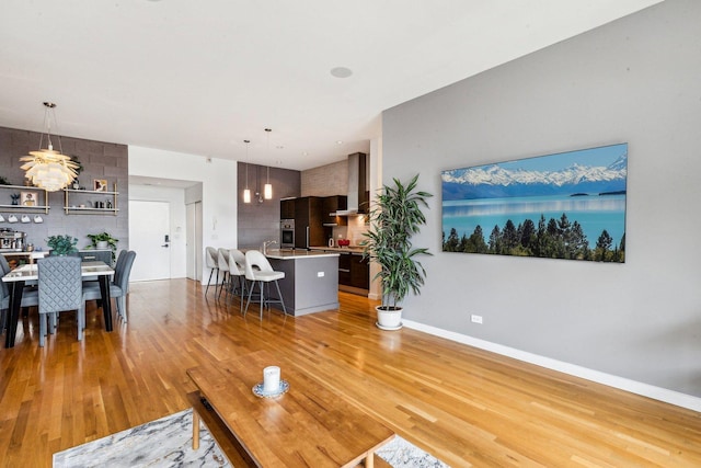 living room with light wood-style floors and baseboards
