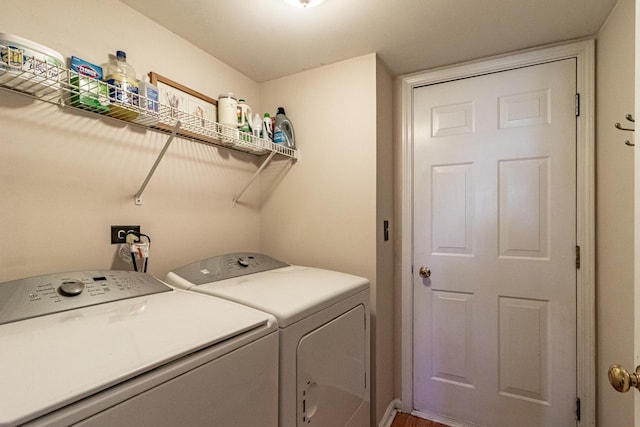 washroom featuring independent washer and dryer and wood finished floors