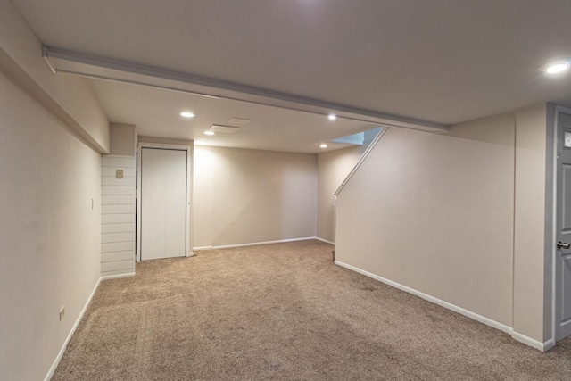 finished below grade area with carpet flooring, recessed lighting, and baseboards