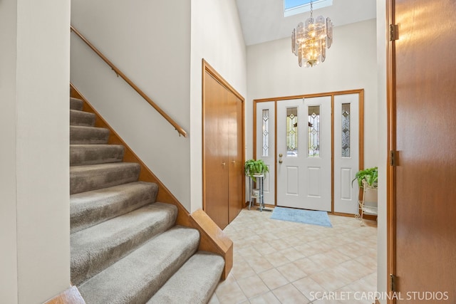 221 Ashley Ct, Oswego, IL 60543 - entrance foyer featuring a high ceiling, stairs, and a chandelier