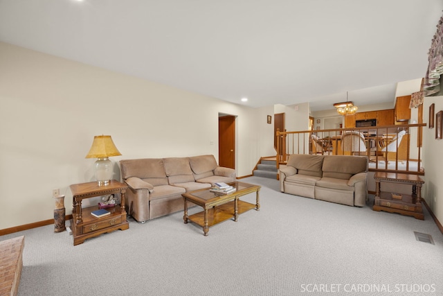221 Ashley Ct, Oswego, IL 60543 - carpeted living room featuring stairs, baseboards, and a chandelier