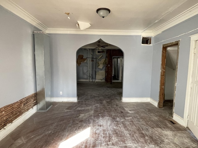 unfurnished room featuring crown molding, visible vents, wood finished floors, baseboards, and arched walkways