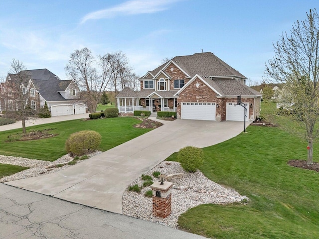 view of front of house with a porch, a front yard, a garage, driveway, and brick siding