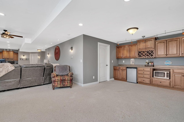 kitchen featuring recessed lighting, ceiling fan, light carpet, baseboards, and appliances with stainless steel finishes