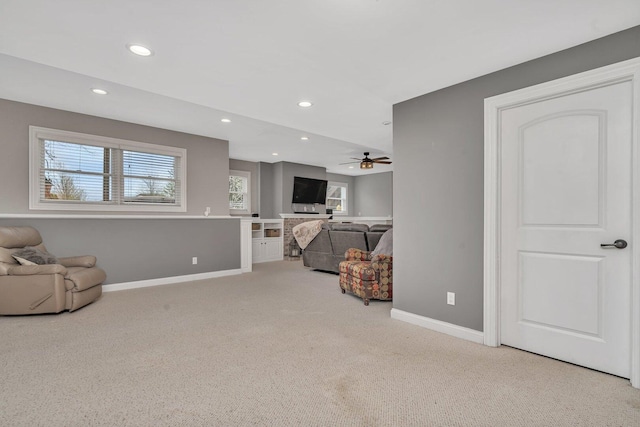 living room with baseboards, recessed lighting, a ceiling fan, and carpet flooring