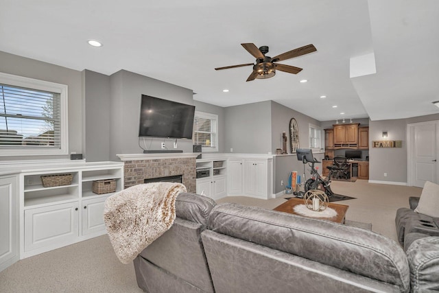 living area with recessed lighting, light carpet, ceiling fan, and plenty of natural light